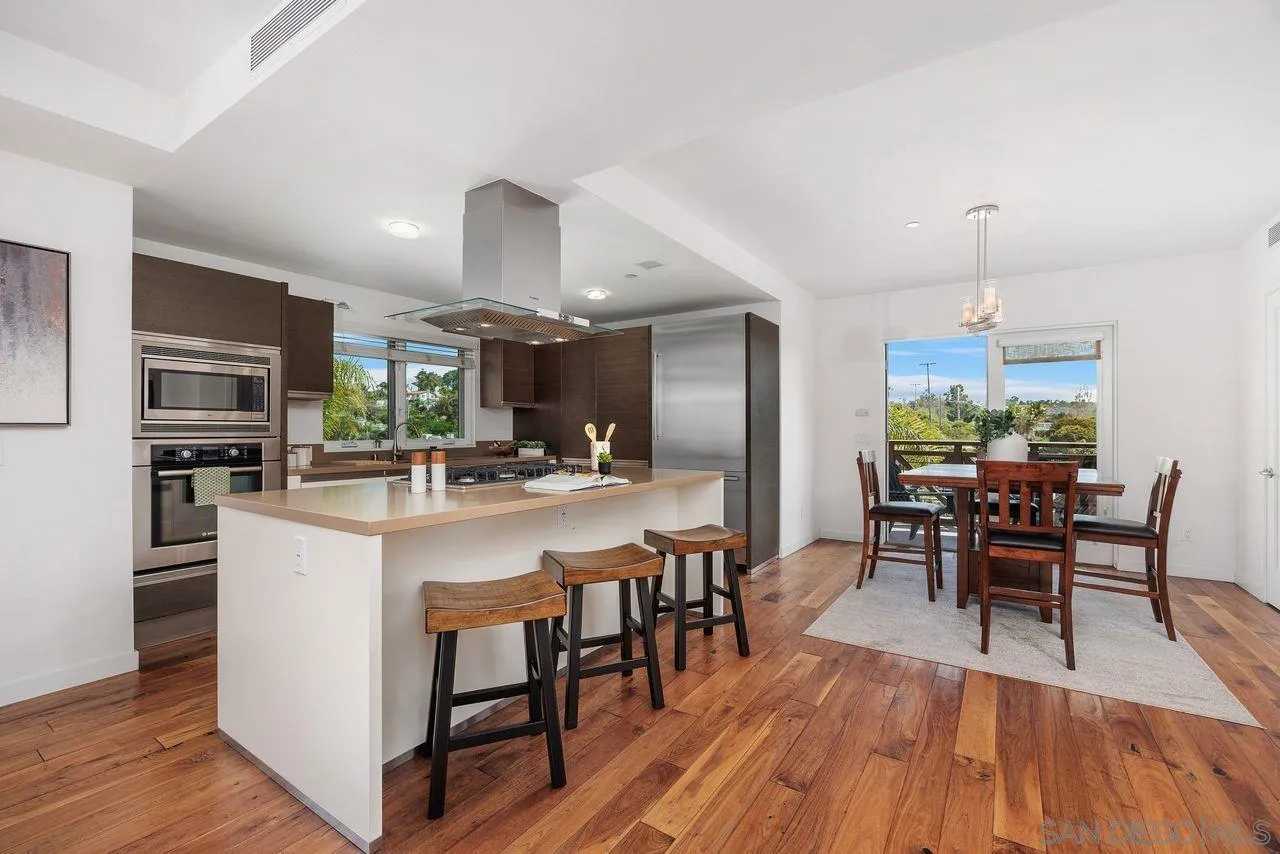 90 North Coast Highway 101 Encinitas, CA 92024 - Photo 15 of 39 a large kitchen with a table and chairs