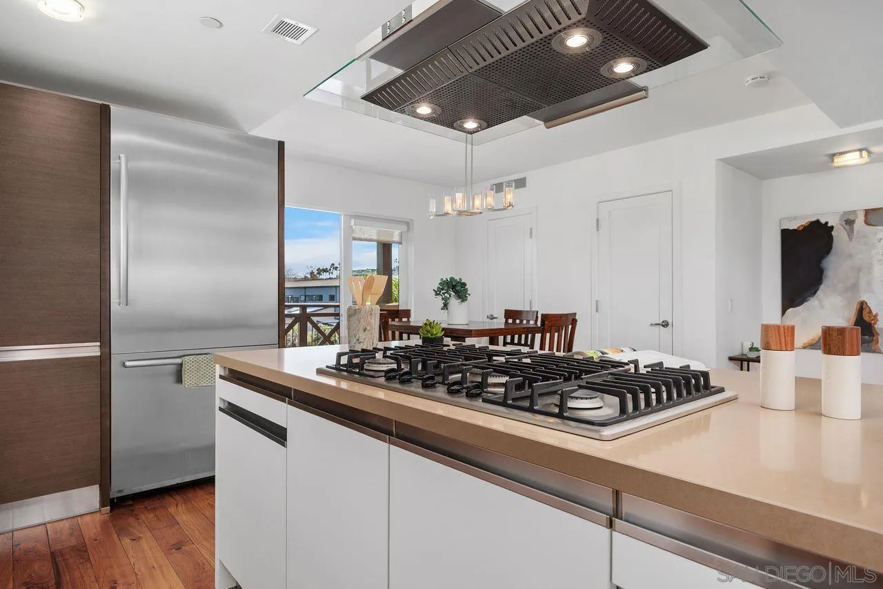 90 North Coast Highway 101 Encinitas, CA 92024 - Photo 17 of 39 a kitchen with stainless steel appliances a sink stove and refrigerator