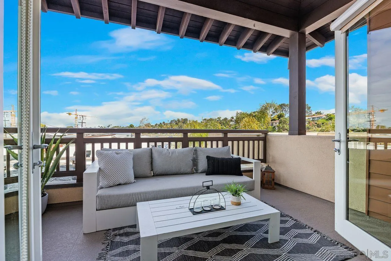 90 North Coast Highway 101 Encinitas, CA 92024 - Photo 20 of 39 a roof deck with couches and wooden floor