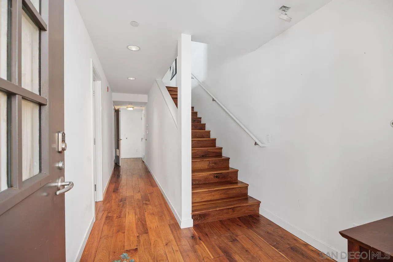 90 North Coast Highway 101 Encinitas, CA 92024 - Photo 5 of 39 a view of a hallway with wooden floor and entryway