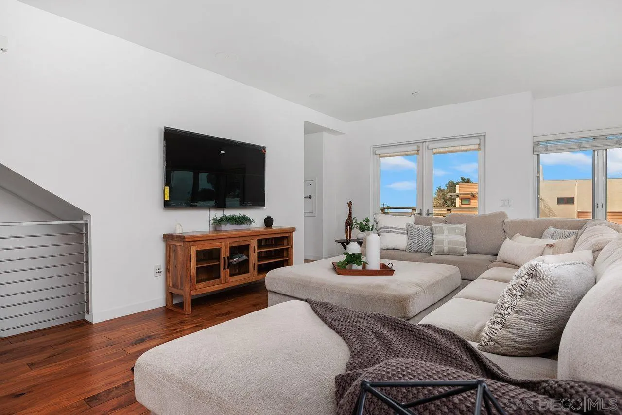 90 North Coast Highway 101 Encinitas, CA 92024 - Photo 6 of 39 a living room with furniture and a flat screen tv