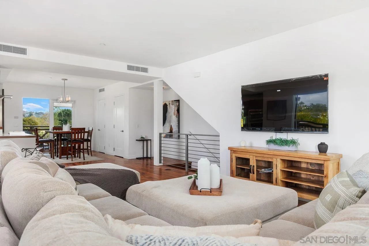 90 North Coast Highway 101 Encinitas, CA 92024 - Photo 8 of 39 a living room with furniture and a flat screen tv