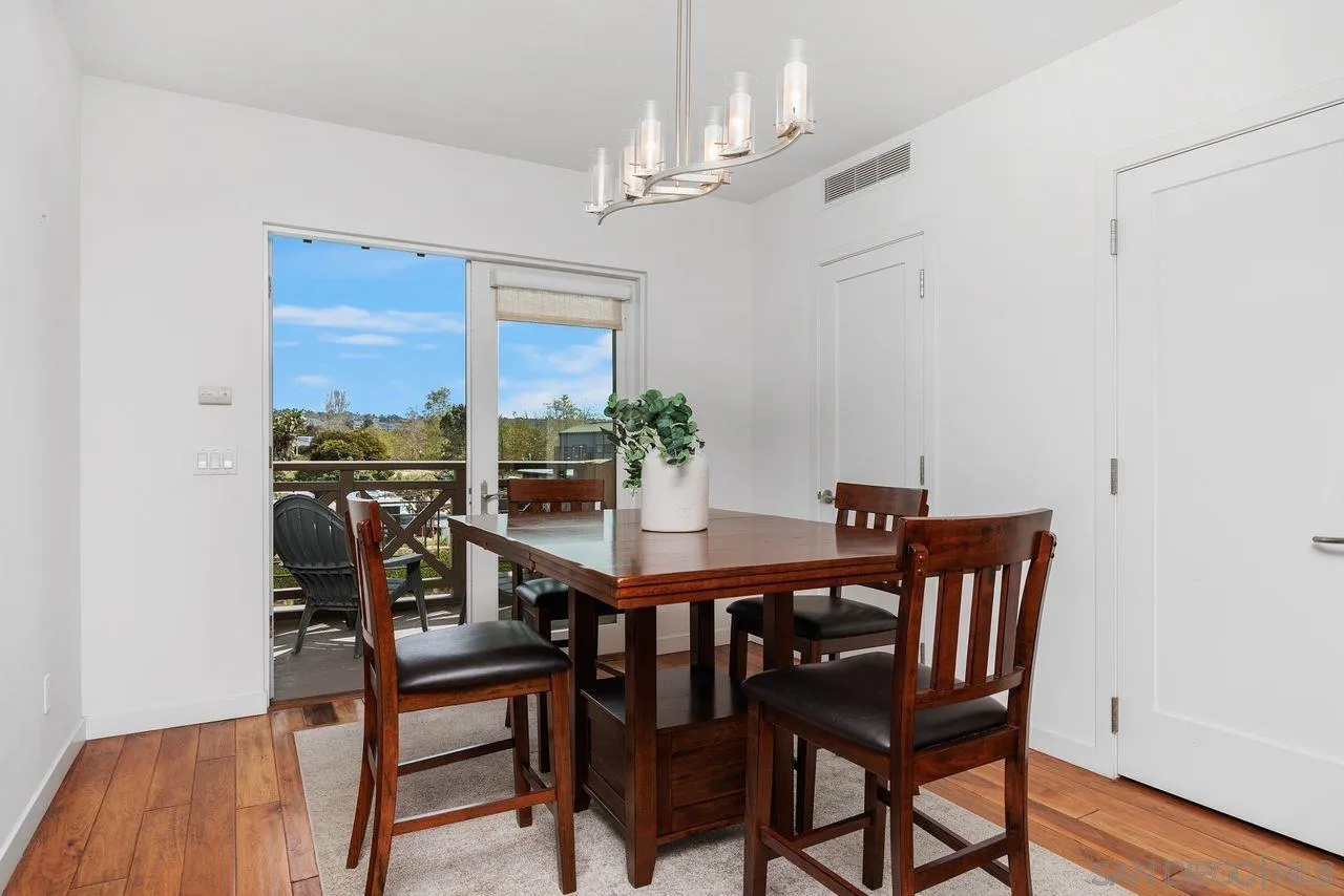 90 North Coast Highway 101 Encinitas, CA 92024 - Photo 9 of 39 a view of a dining room with furniture window and wooden floor