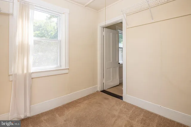 a bathroom with a tub shower and a sink