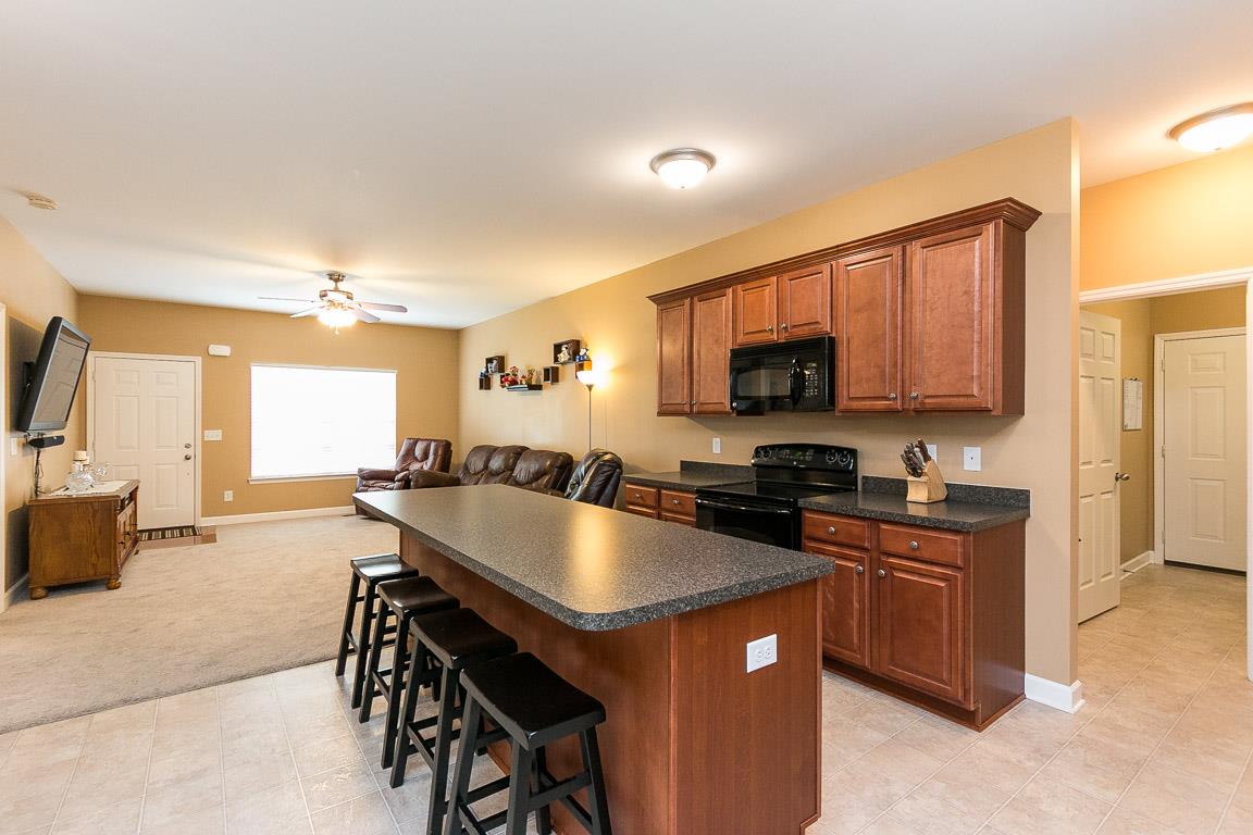 140 Abbey Road Lebanon, TN 37090 - Photo 8 of 30 a kitchen with granite countertop a sink stove and microwave