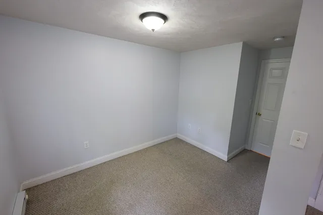 an empty room with a empty space and window