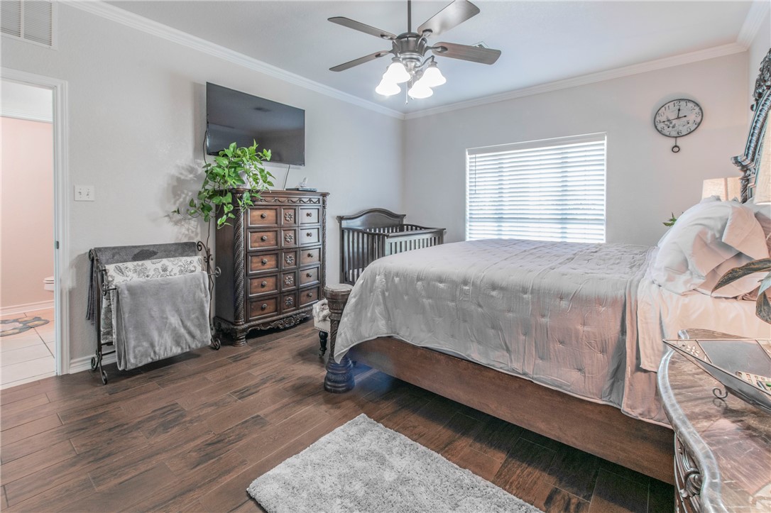 876 South St Joseph Road Burlington, TX 76519 - Photo 12 of 35 a bedroom with a bed dresser and a window
