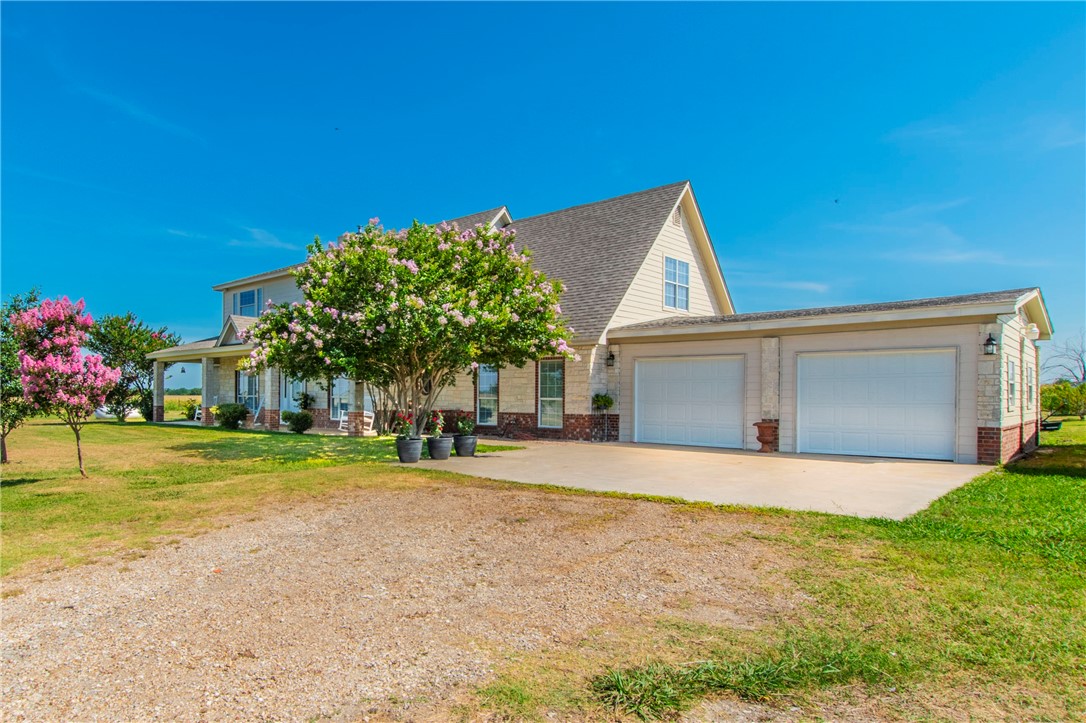 876 South St Joseph Road Burlington, TX 76519 - Photo 2 of 35 a front view of house with yard and trees in the background