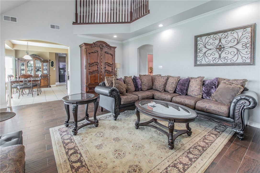 876 South St Joseph Road Burlington, TX 76519 - Photo 6 of 35 a living room with furniture a table and a painting on the wall