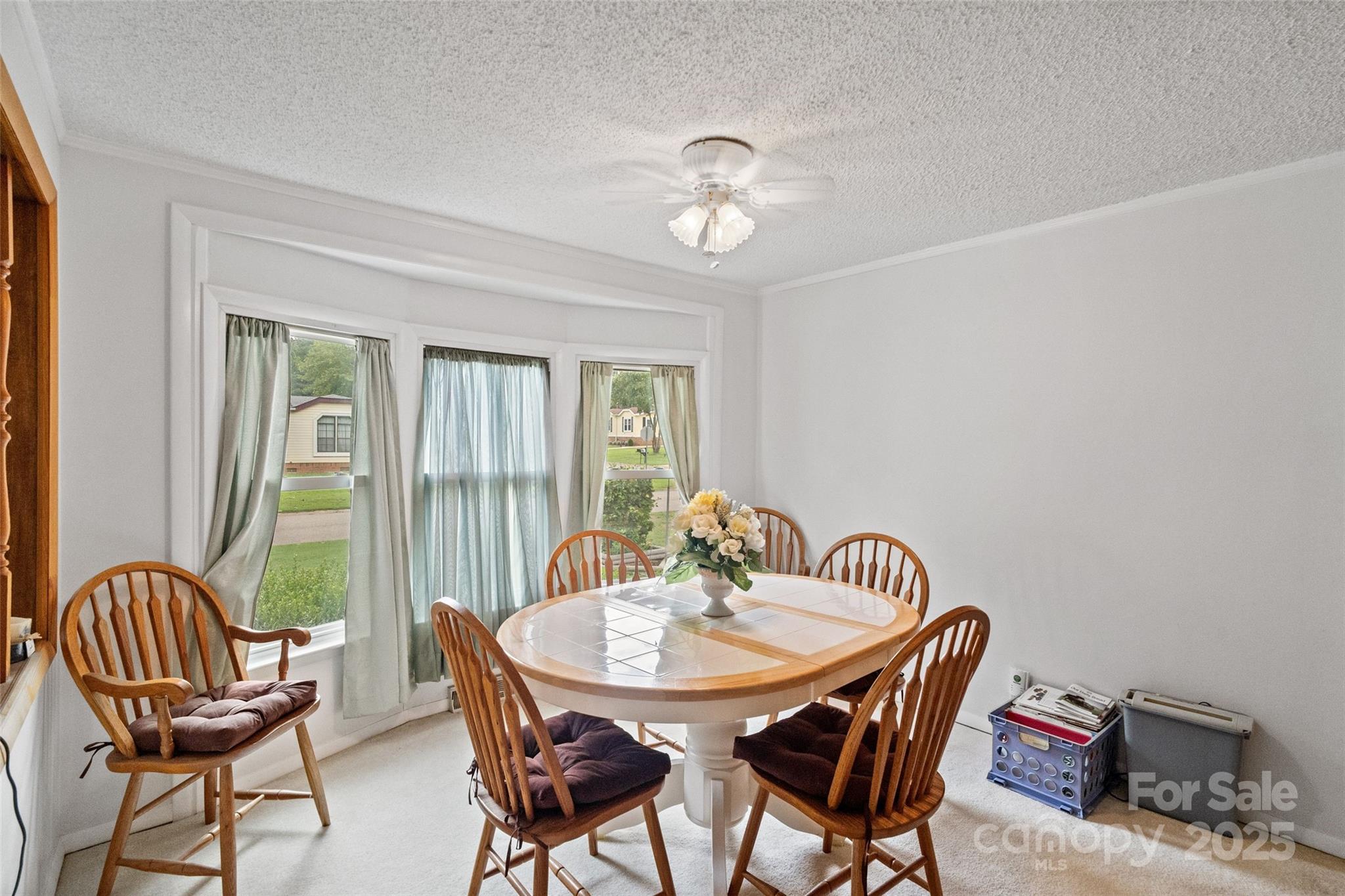 5909 Lake Valley Road Clover, SC 29710 - Photo 11 of 44 a view of a dining room with furniture and a chandelier