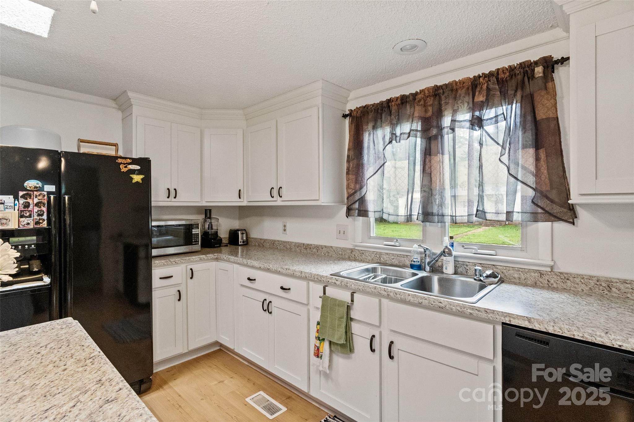 5909 Lake Valley Road Clover, SC 29710 - Photo 16 of 44 a kitchen with a sink stove and refrigerator