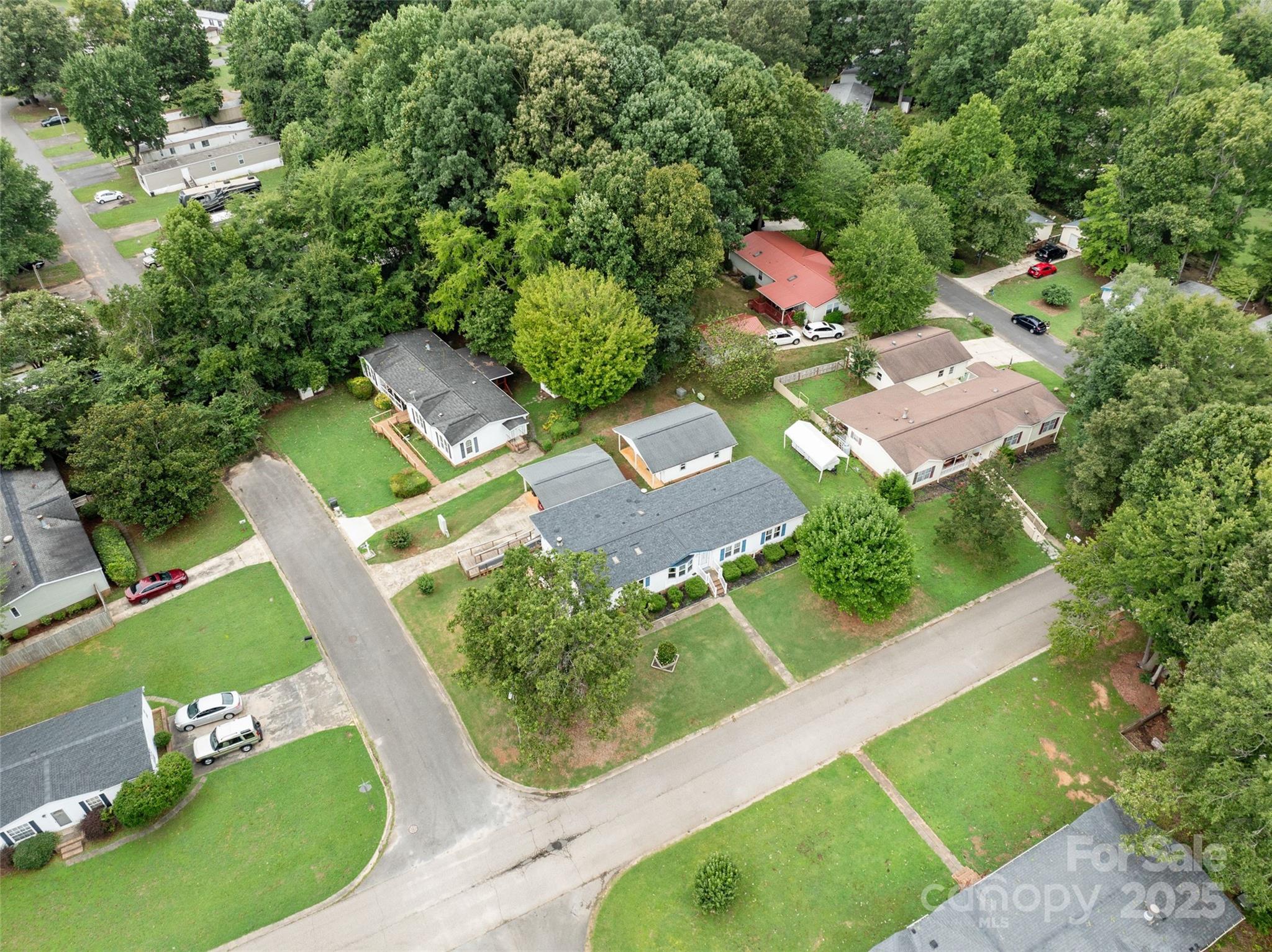 5909 Lake Valley Road Clover, SC 29710 - Photo 2 of 44 an aerial view of a house with a garden and swimming pool