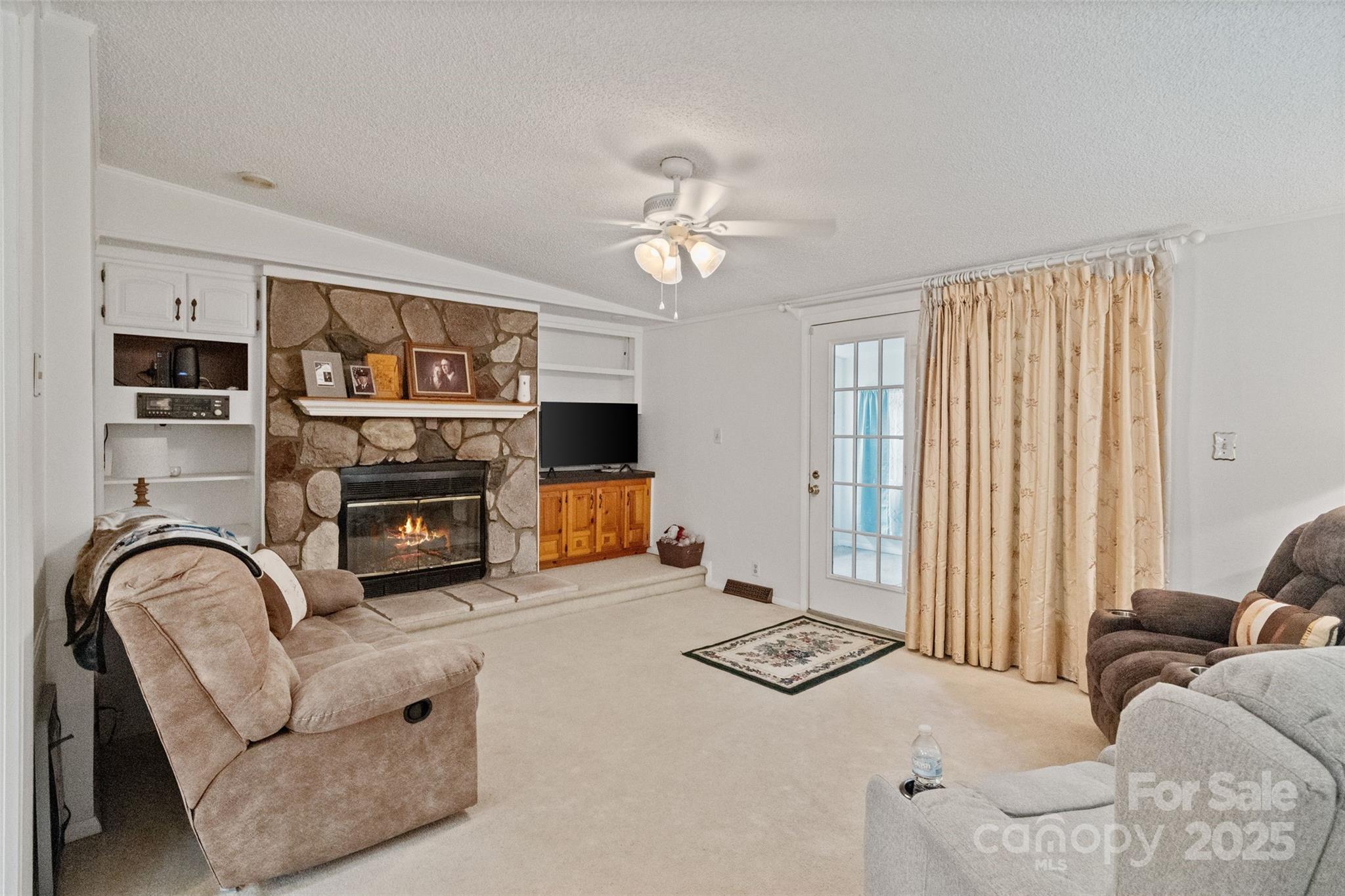 5909 Lake Valley Road Clover, SC 29710 - Photo 23 of 44 a living room with furniture fireplace and flat screen tv