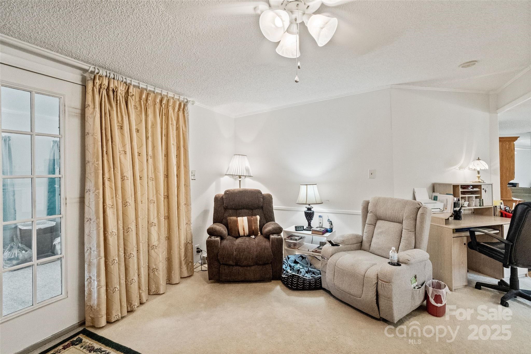5909 Lake Valley Road Clover, SC 29710 - Photo 25 of 44 a living room with furniture and a chandelier