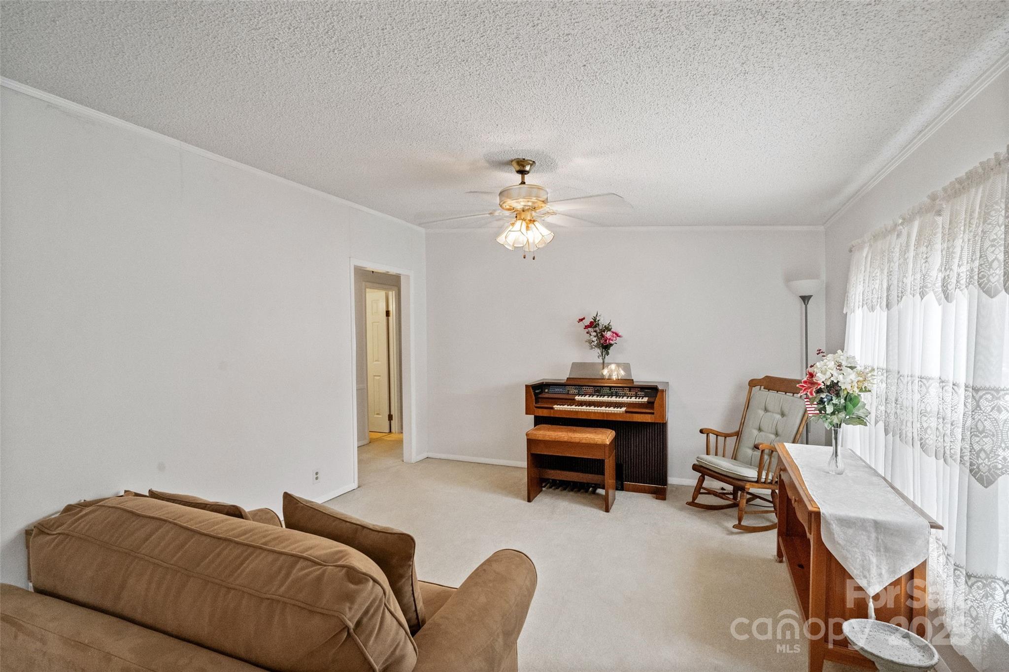 5909 Lake Valley Road Clover, SC 29710 - Photo 26 of 44 a bed room with a bed and a chandelier