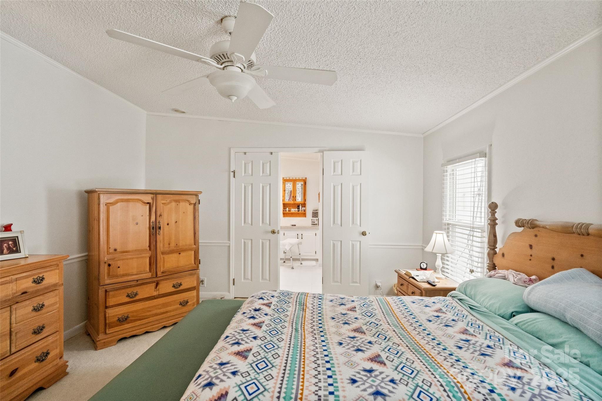 5909 Lake Valley Road Clover, SC 29710 - Photo 28 of 44 a bedroom with a bed and wooden floor