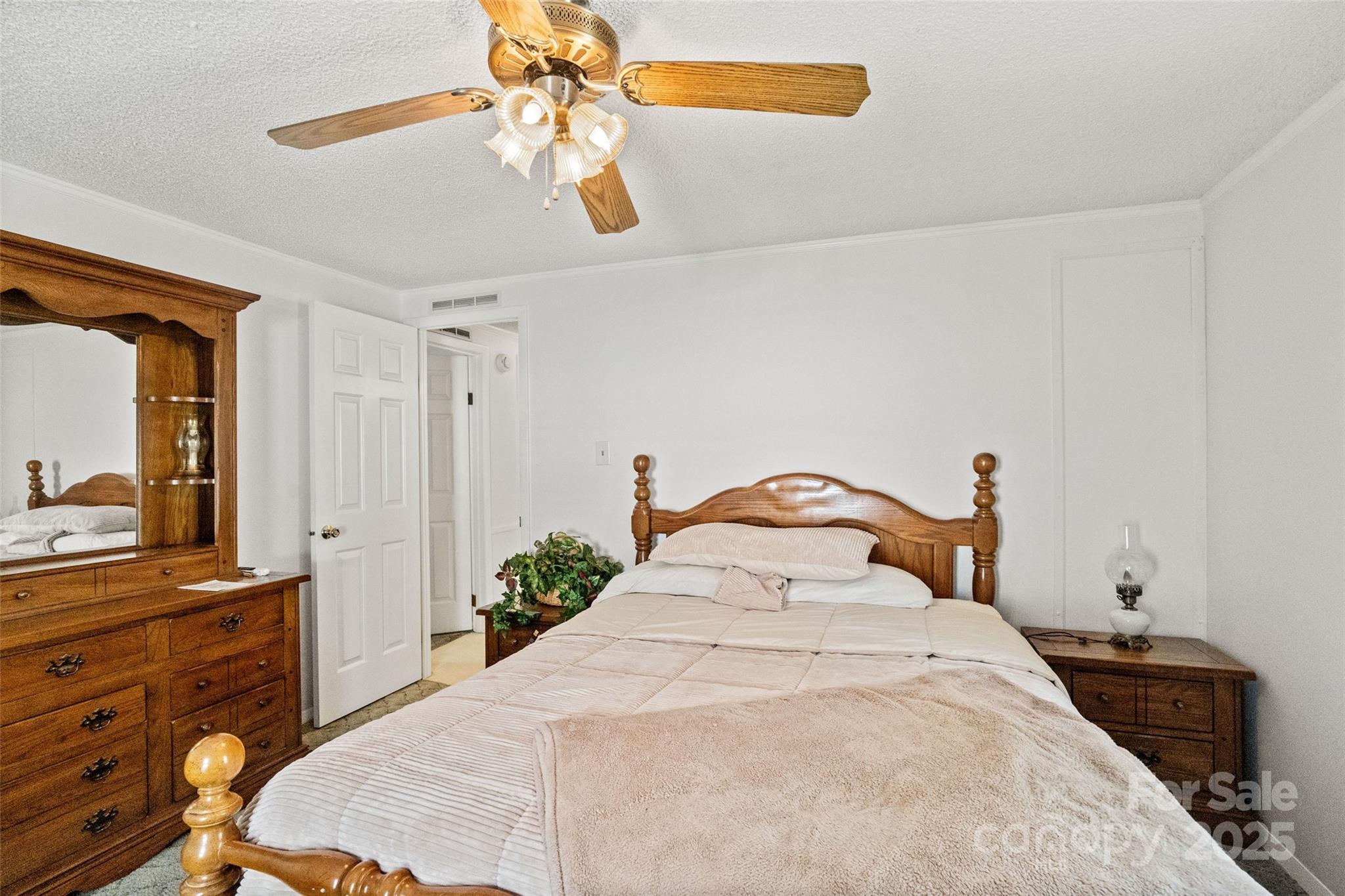 5909 Lake Valley Road Clover, SC 29710 - Photo 32 of 44 a bedroom with a bed and a mirror on the dresser