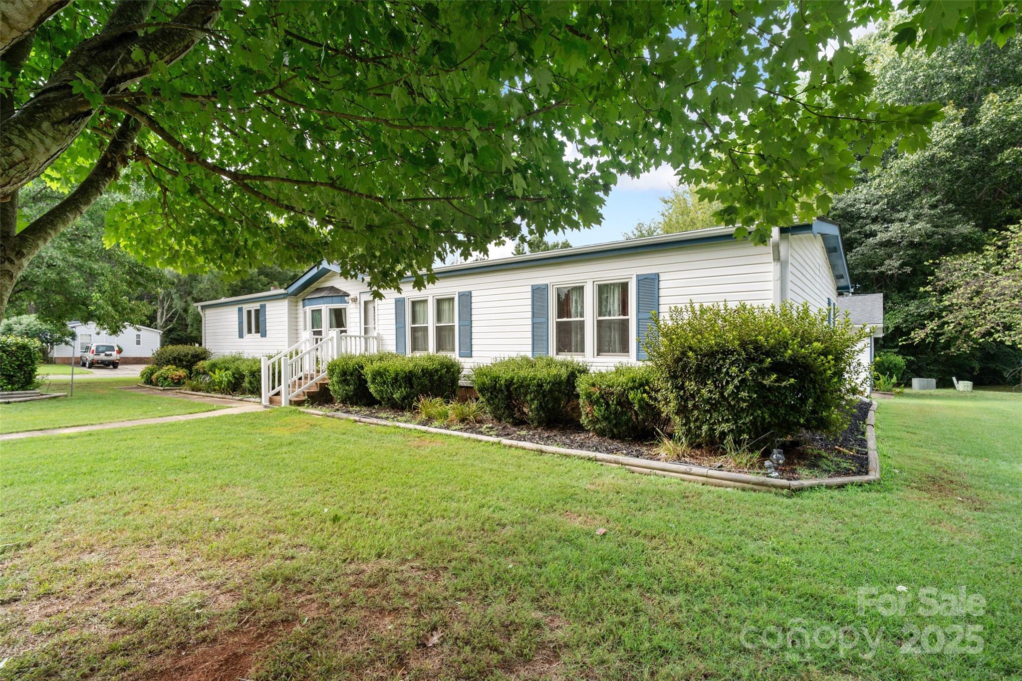 5909 Lake Valley Road Clover, SC 29710 - Photo 42 of 44 a front view of a house with a yard