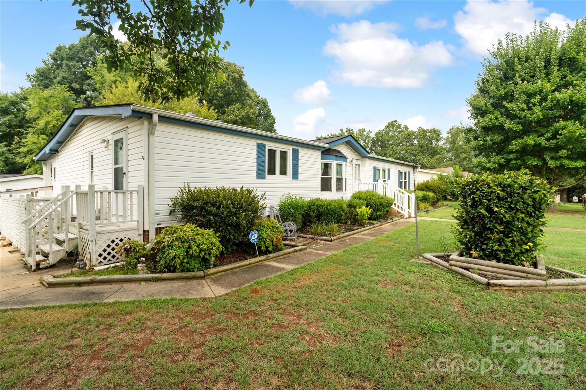 5909 Lake Valley Road Clover, SC 29710 - Photo 43 of 44 a view of a house with a yard and potted plants