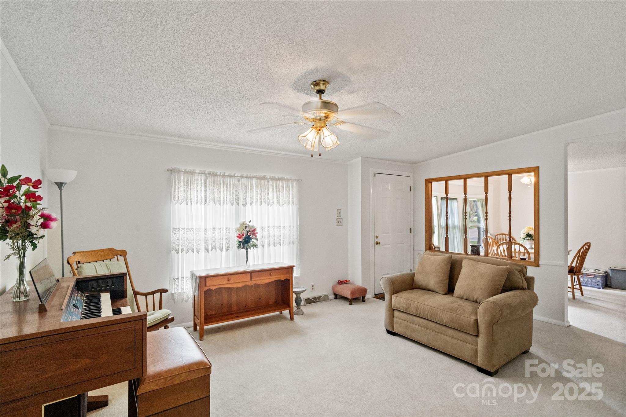 5909 Lake Valley Road Clover, SC 29710 - Photo 9 of 44 a living room with furniture and a chandelier