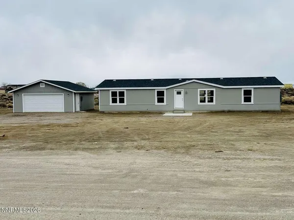 a big house with a big yard and large trees