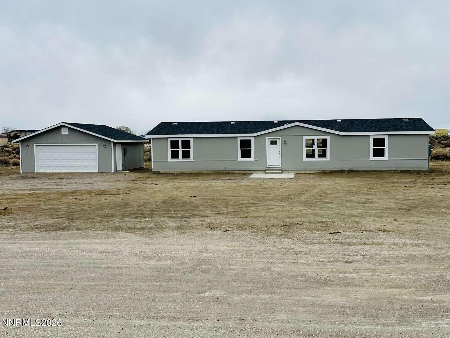 a big house with a big yard and large trees