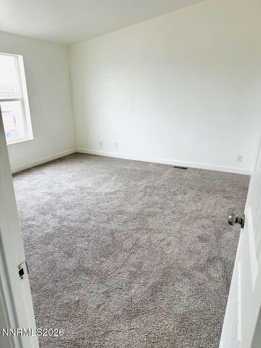 6255 Sierra Way Fallon, NV 89406 - Photo 13 of 25 an empty room with windows