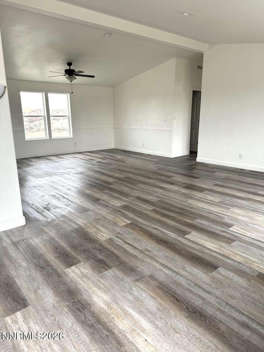 6255 Sierra Way Fallon, NV 89406 - Photo 6 of 25 a view of empty room with wooden floor and fan