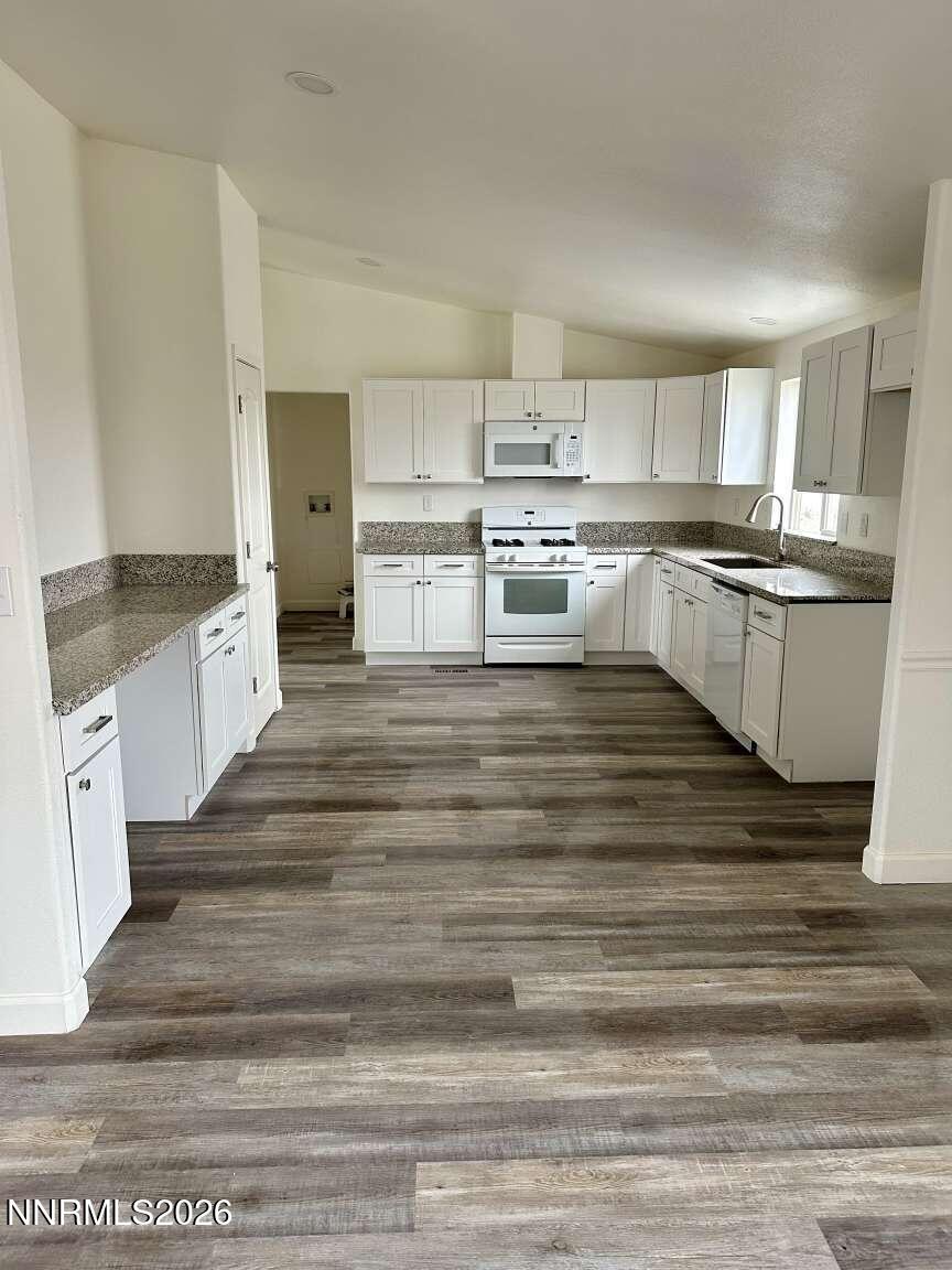 6255 Sierra Way Fallon, NV 89406 - Photo 7 of 25 a large white kitchen with cabinets