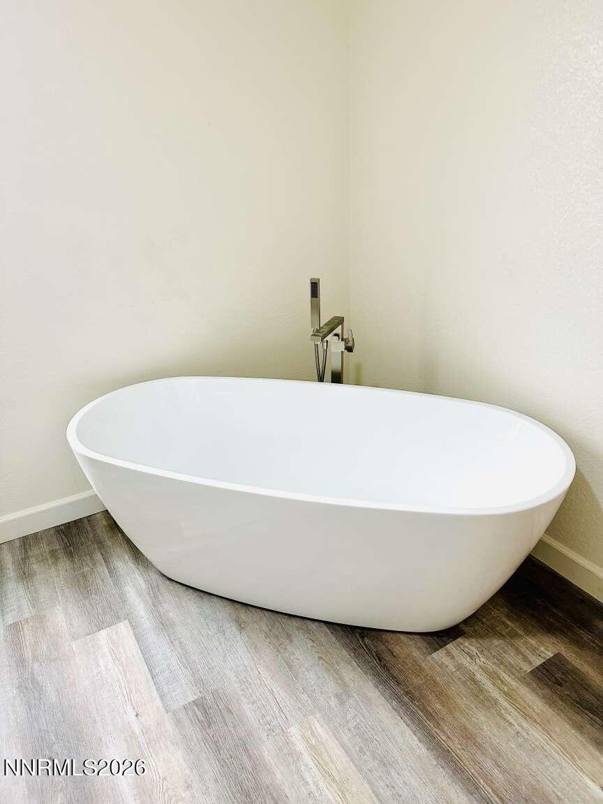 6255 Sierra Way Fallon, NV 89406 - Photo 10 of 25 a white tub sitting next to a white wall