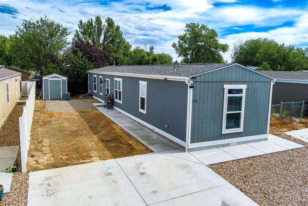 271 Clements Way Fruita, CO 81521 - Photo 1 of 26 front view of a house with a yard