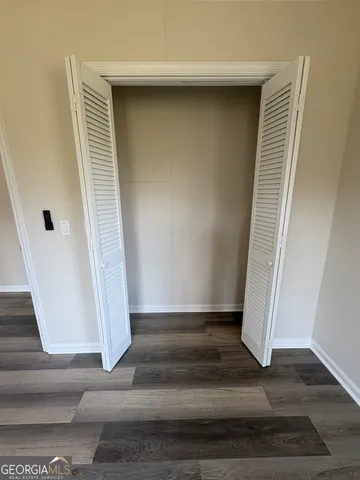 a view of staircase with white walls