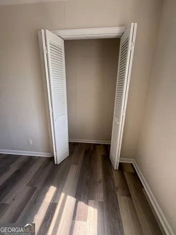 an entryway of a house with wooden floor