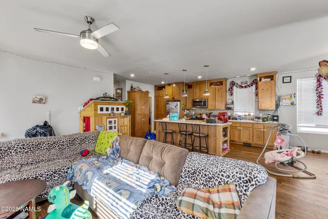 a living room with furniture and a table