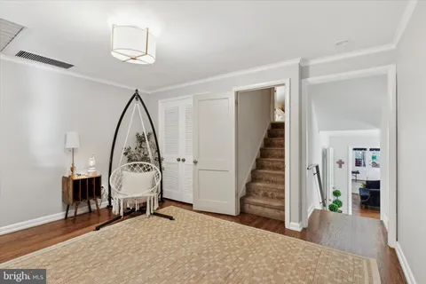 a spacious bedroom with a bed and ceiling fan