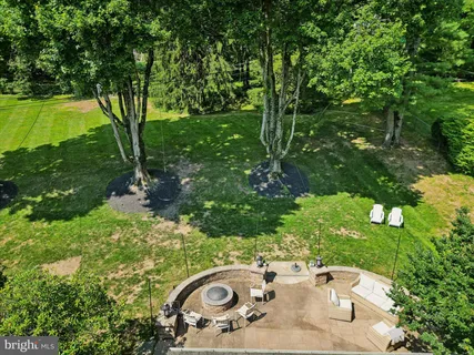 a view of a grassy field with trees
