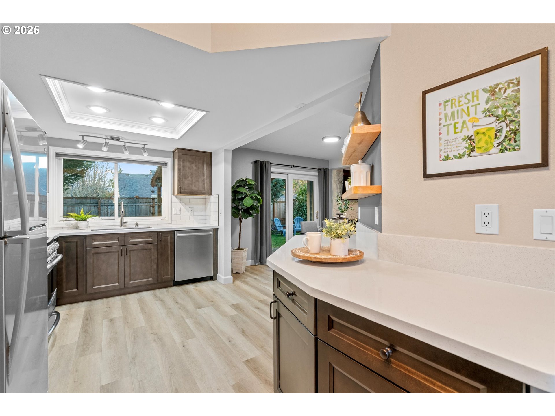 15975 Southwest 87th Avenue Portland, OR 97224 - Photo 12 of 35 a kitchen with a sink and cabinets