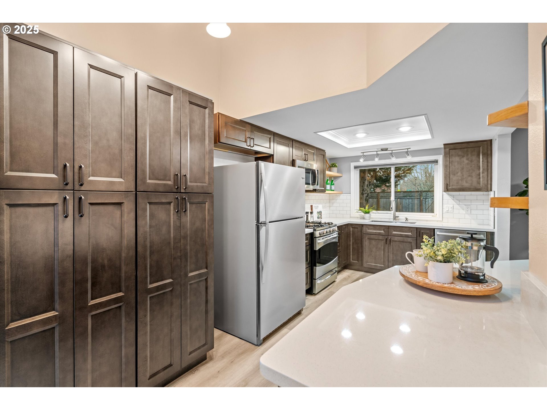 15975 Southwest 87th Avenue Portland, OR 97224 - Photo 13 of 35 a kitchen with refrigerator and window