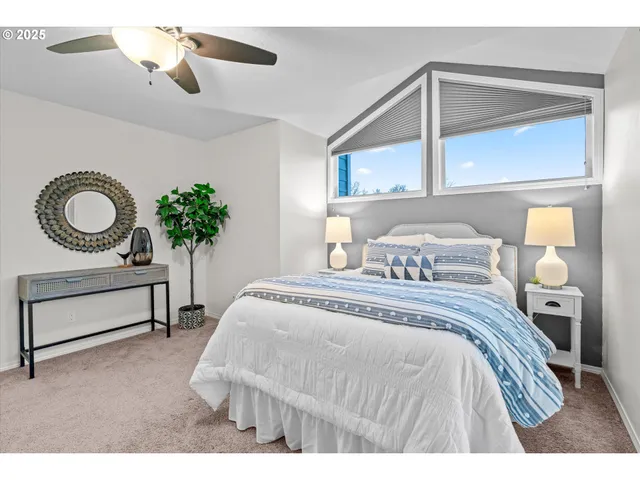 a bedroom with a bed and window