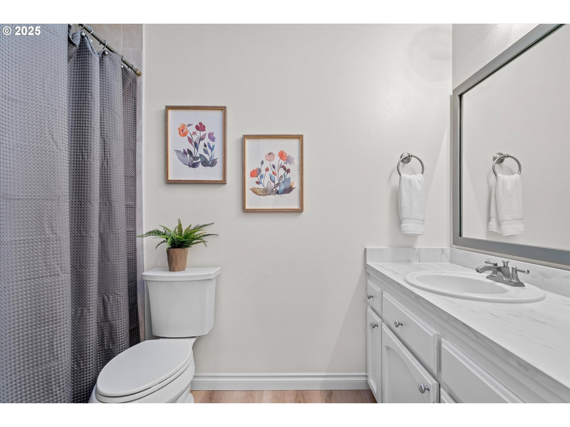 15975 Southwest 87th Avenue Portland, OR 97224 - Photo 20 of 35 a bathroom with a toilet a sink and a mirror
