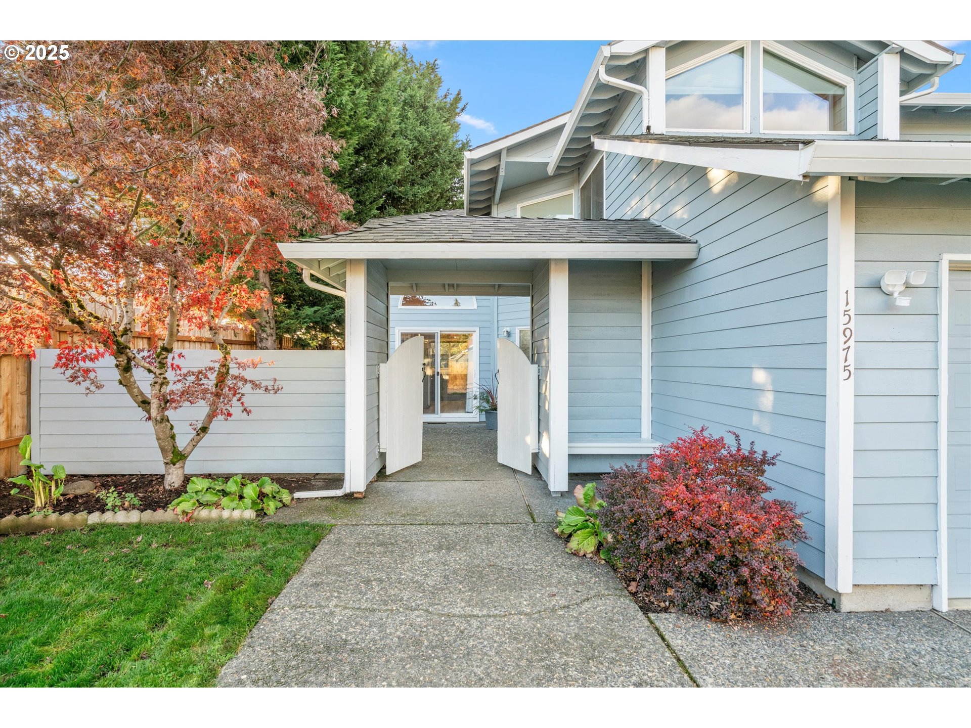 15975 Southwest 87th Avenue Portland, OR 97224 - Photo 2 of 35 a front view of a house with garden