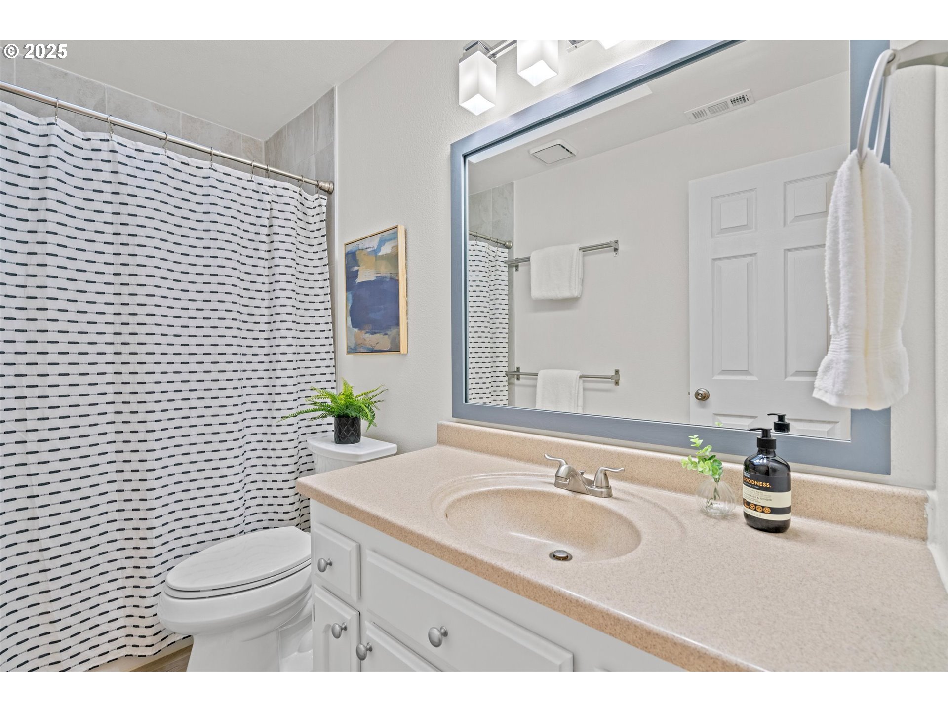 15975 Southwest 87th Avenue Portland, OR 97224 - Photo 21 of 35 a bathroom with a sink a toilet and mirror