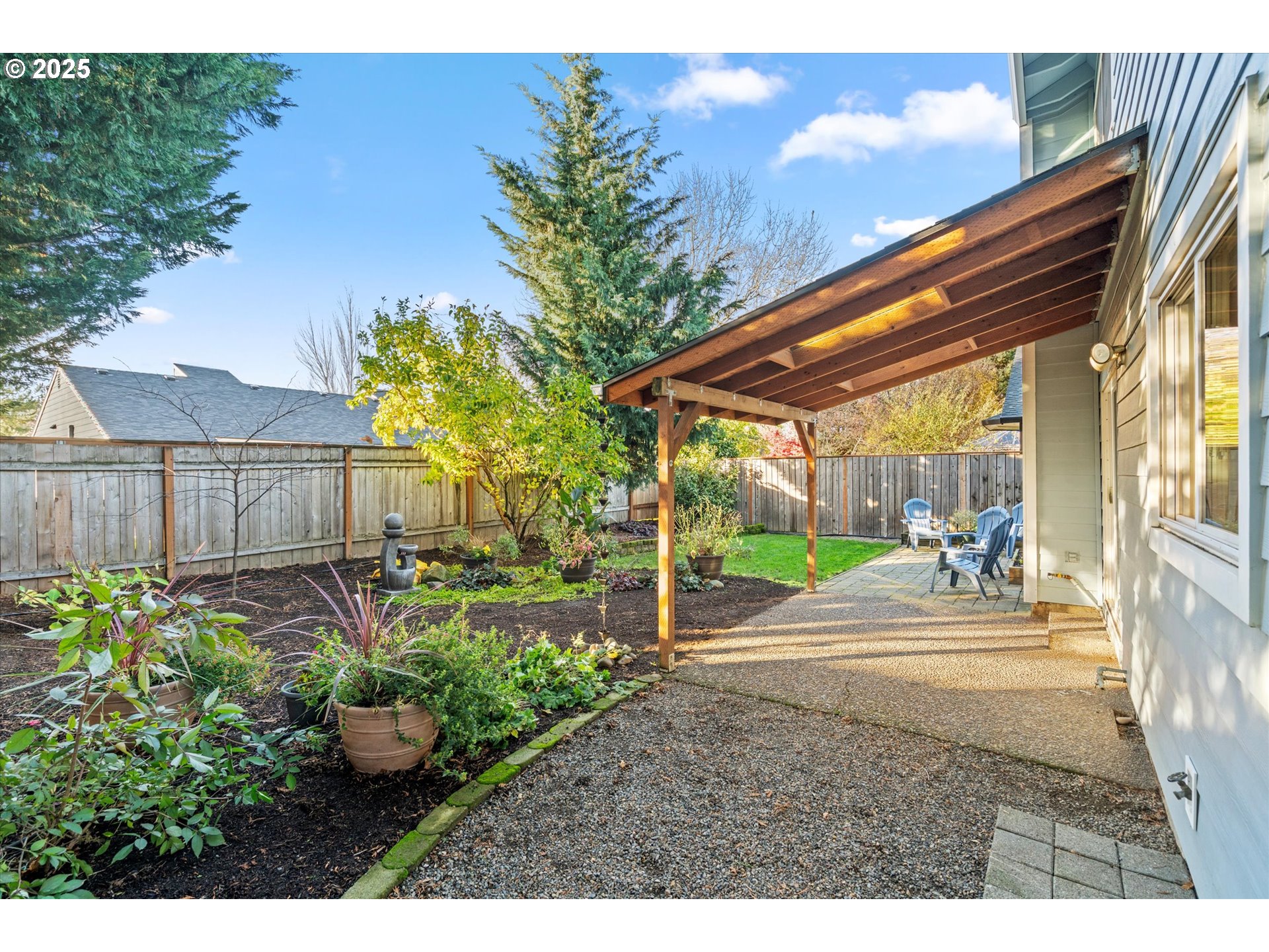 15975 Southwest 87th Avenue Portland, OR 97224 - Photo 28 of 35 a backyard of a house with table and chairs