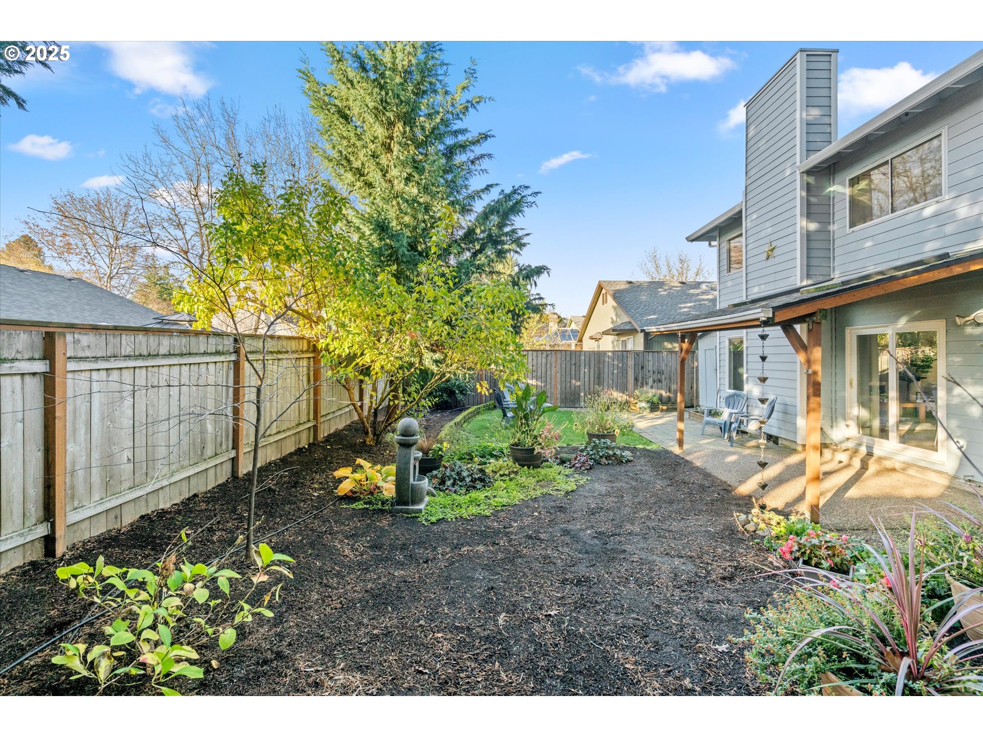 15975 Southwest 87th Avenue Portland, OR 97224 - Photo 29 of 35 a view of a house with backyard and sitting area
