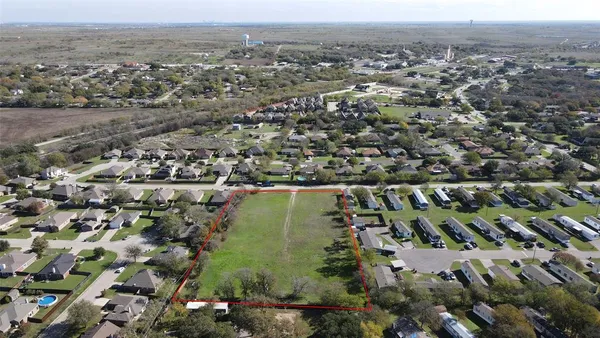 an aerial view of residential house with outdoor space