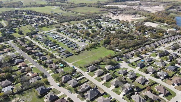 an aerial view of residential building and lake view