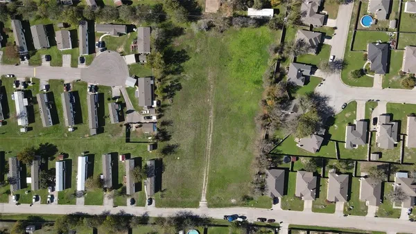 an aerial view of city and parking space