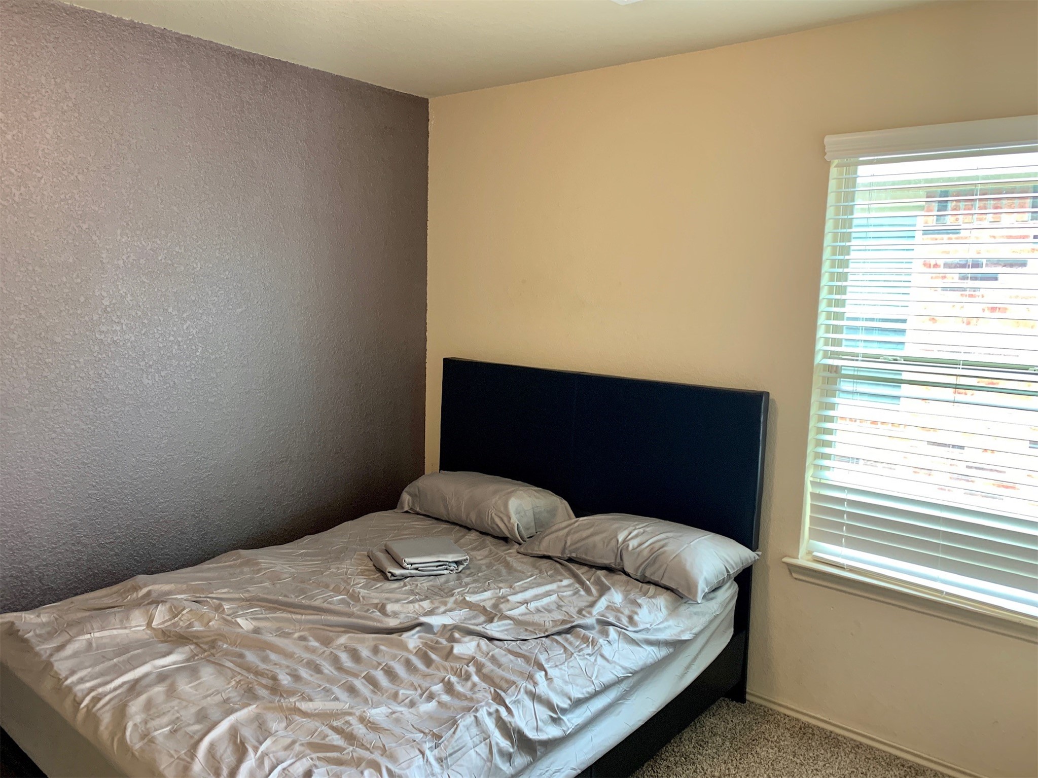 1345 Lariat Rdg Trail Houston, TX 77049 - Photo 12 of 25 a bedroom with a bed and a window