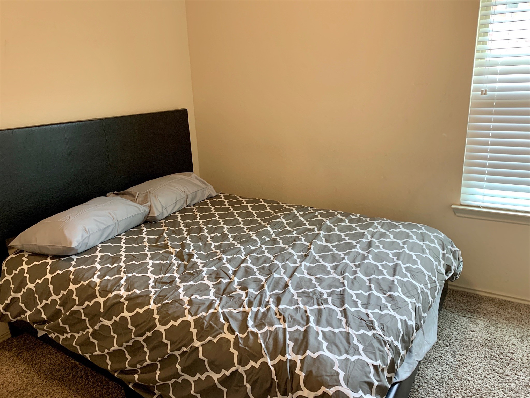 1345 Lariat Rdg Trail Houston, TX 77049 - Photo 19 of 25 a bedroom with a bed and a window