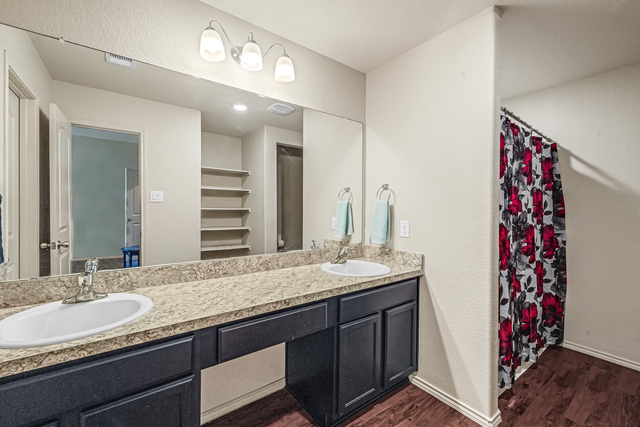 1345 Lariat Rdg Trail Houston, TX 77049 - Photo 20 of 25 a bathroom with a granite countertop sink and a mirror